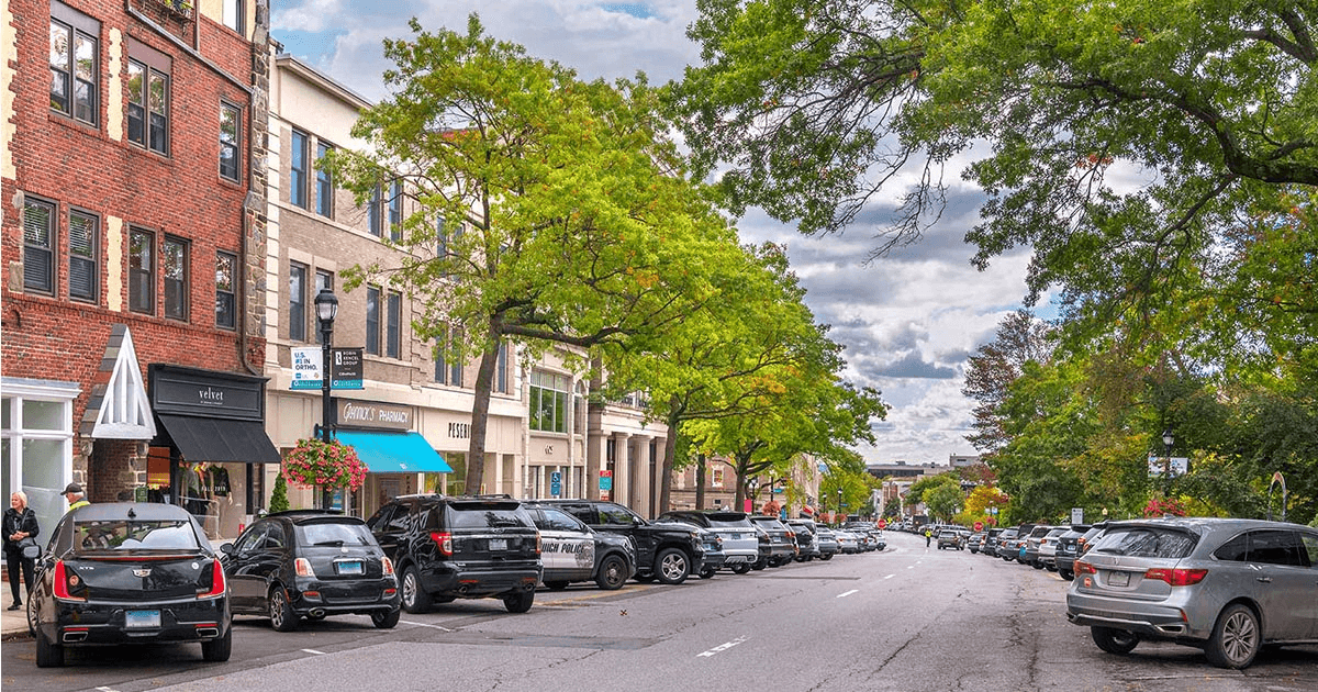 Greenwich downtown street with shops and pedestrians